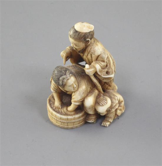 A Japanese ivory okimono of a family group, Meiji period, 4.5cm high (no. 522)